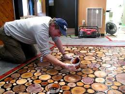 Spreading the epoxy over sanded wooden disks.png